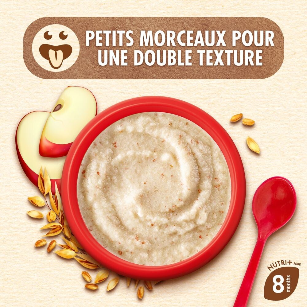 Bol de porridge aux morceaux de pomme, cuillère rouge et grains d'avoine.