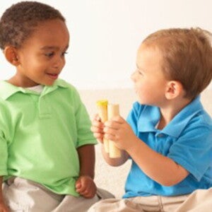 Baby boys playing with wooden toys Baby boys playing with wooden toys