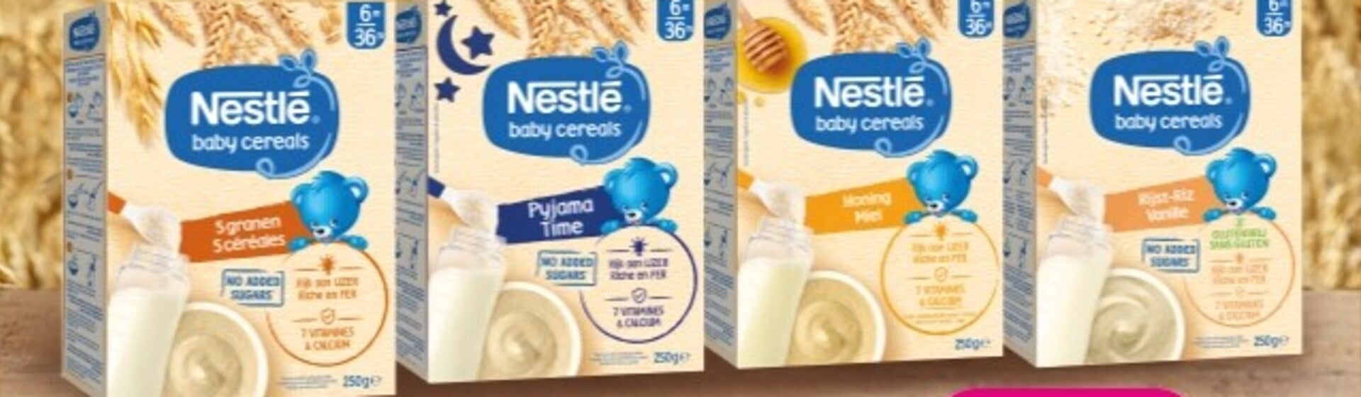 Assortiment babygraanverpakkingen met Nestlé- en Cerelac-logo's op houten ondergrond