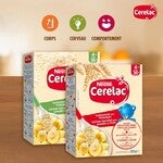 Deux boîtes de céréales infantiles Nestlé Cerelac, saveur banane, photographiées sur une table en bois